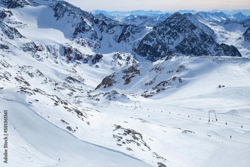 Panoramic view of Alps mountain snowy range with skiing trails, Stubai Glacier