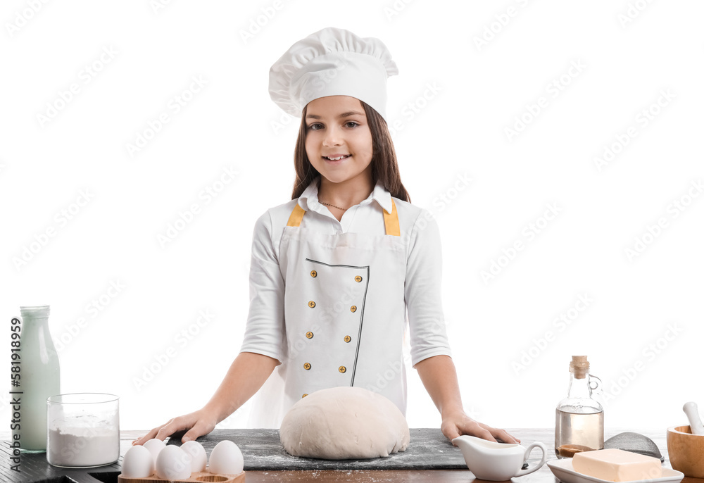 Little baker at table with dough on white background