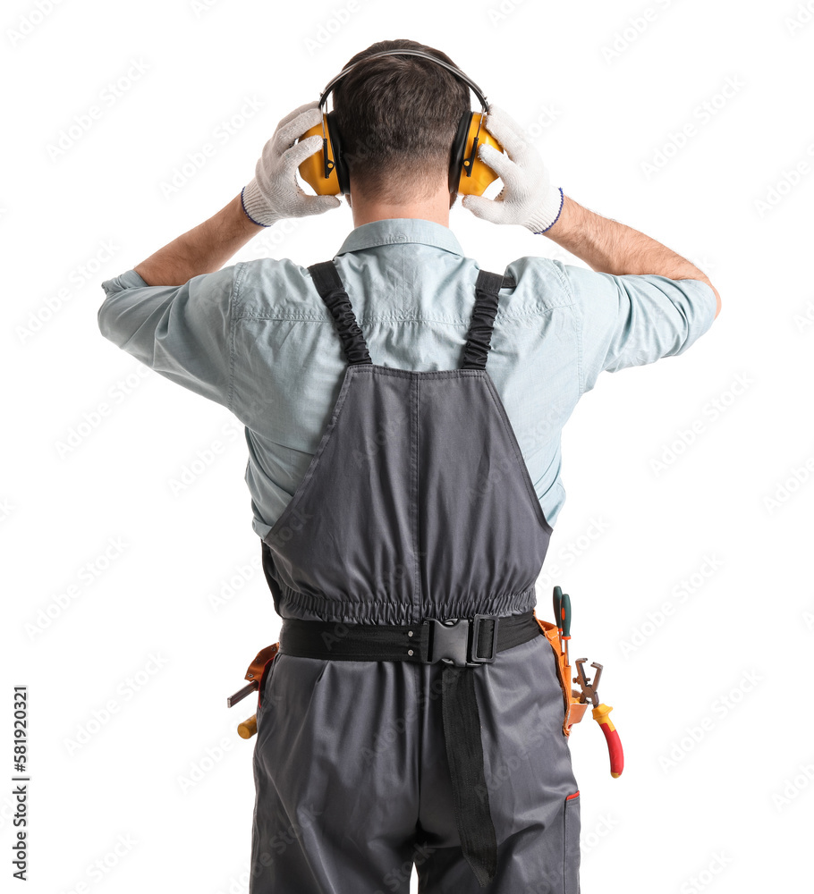 Male carpenter in hearing protectors on white background, back view