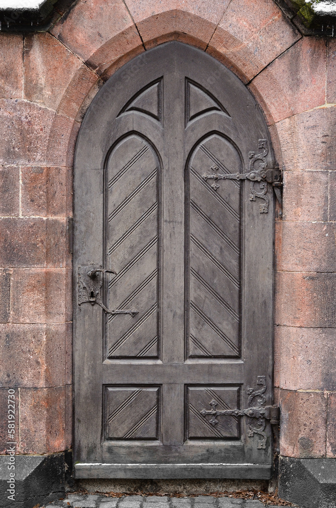 View of old building with wooden door