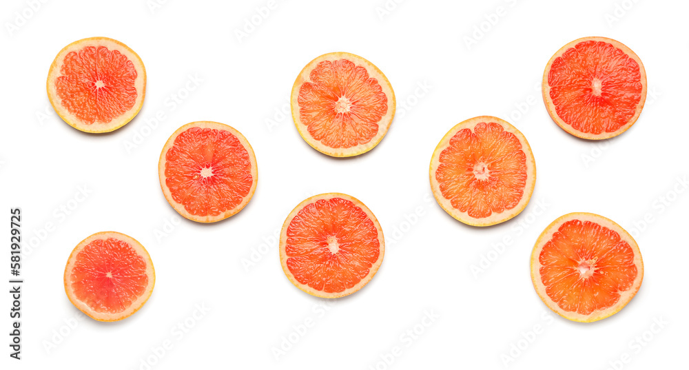 Composition with slices of ripe grapefruit on white background