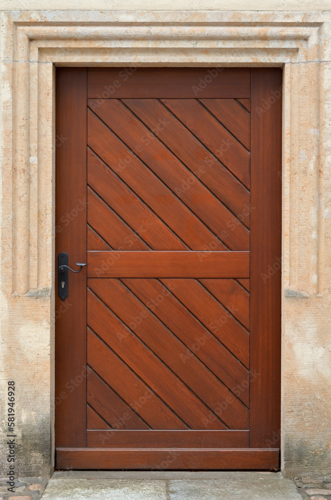 View of old building with wooden door