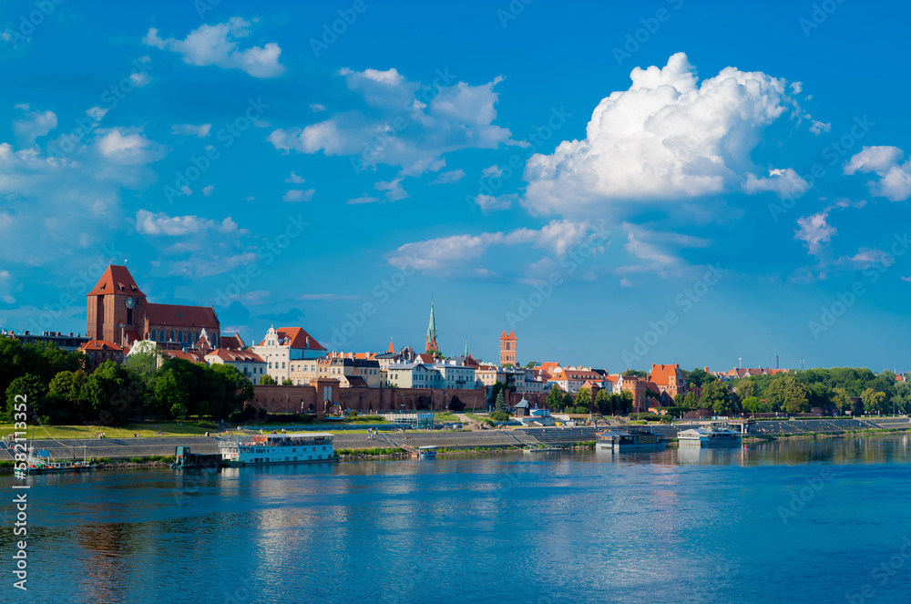 View of Old City of Torun. Vistula (Wisla) river against the backdrop of the historical buildings of