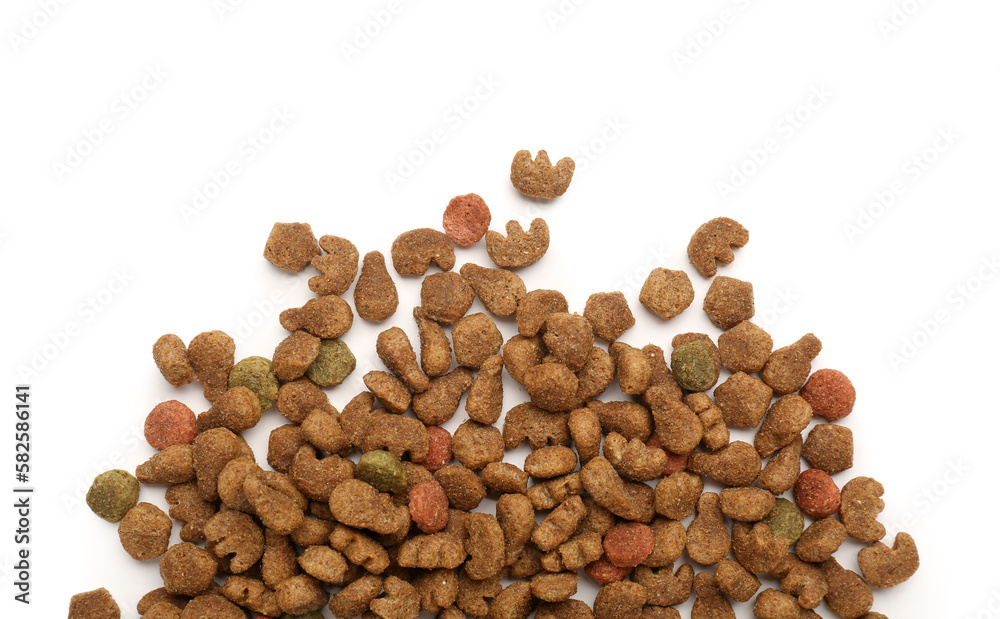 Heap of dry pet food isolated on white background, closeup