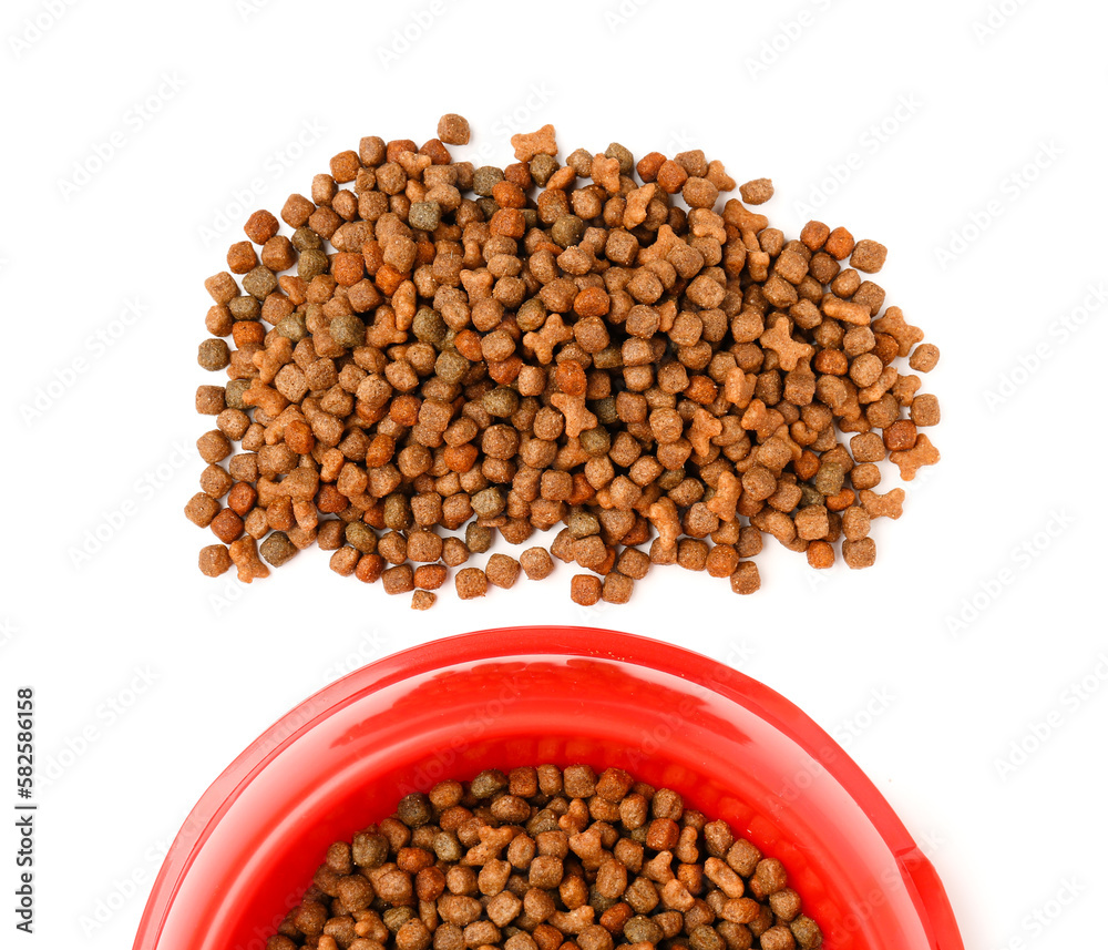 Red bowl of dry pet food on white background, closeup