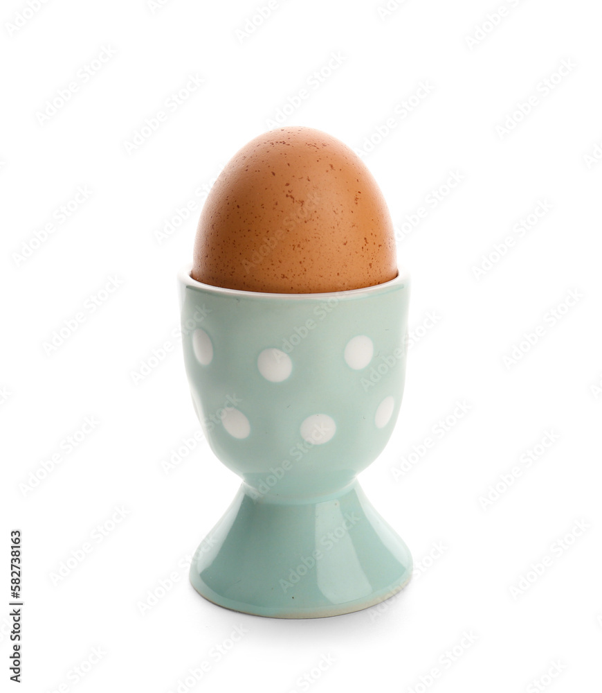 Holder with delicious boiled egg isolated on white background