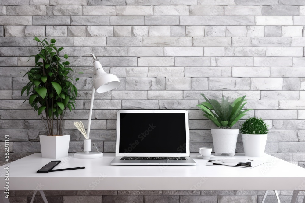 a blank workspace with a laptop and a plant against a stone wall. concept of working from home. Gene