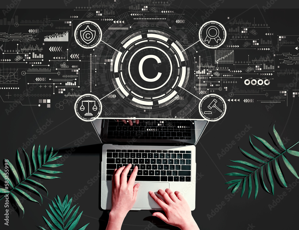 Copyright concept with person using a laptop computer