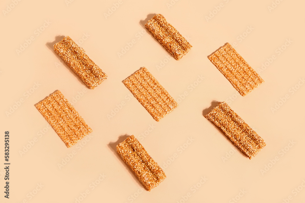 Composition with tasty sesame kozinaki on color background