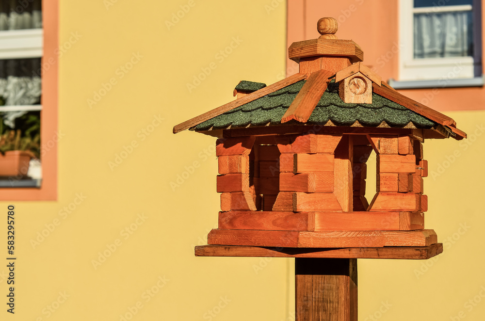 View of wooden bird house outdoors, closeup