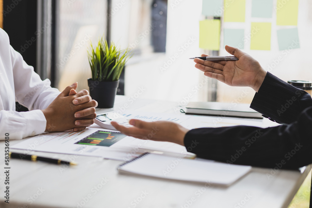 Businesswoman colleagues in the office discussing work and planning a business business project.