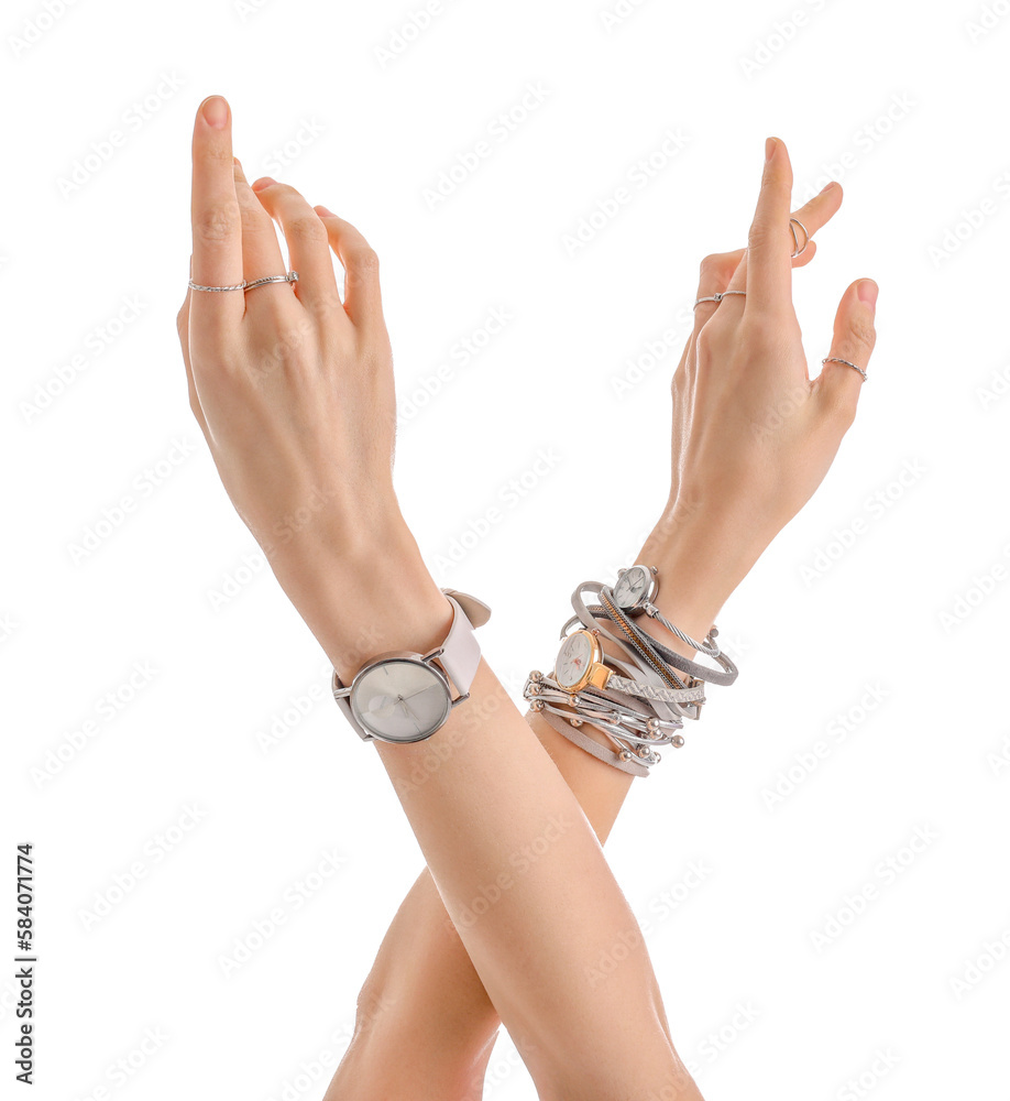 Woman with stylish wristwatches on white background