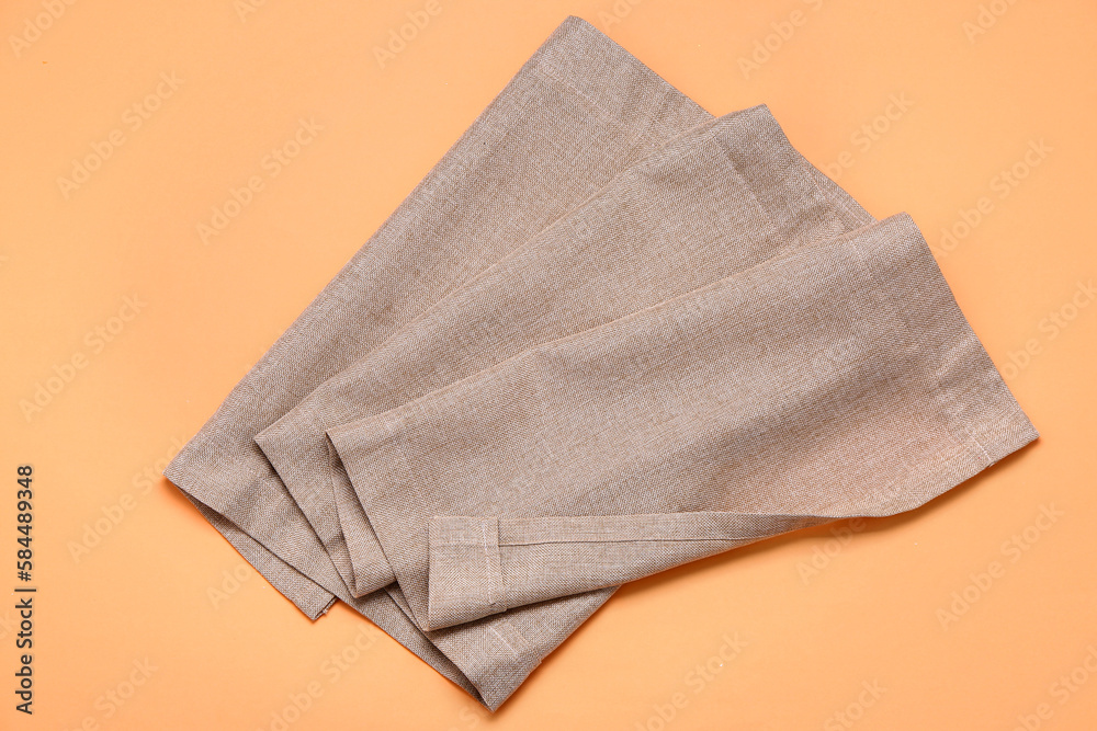 Clean napkins on orange background