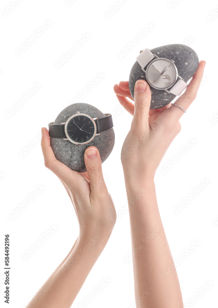 Woman with spa stones and stylish wristwatches on white background