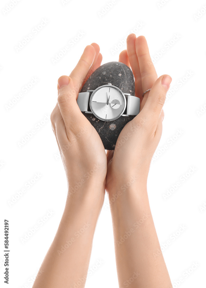 Woman with spa stone and stylish wristwatch on white background