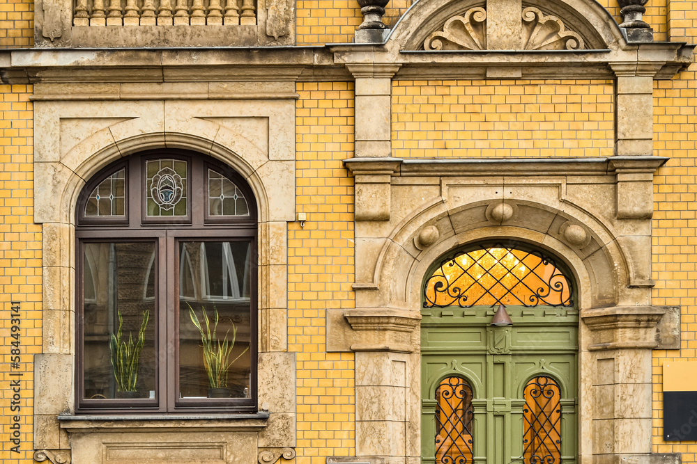 View of brick building with wooden window and door