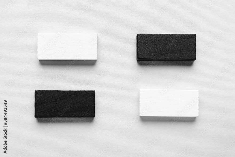 Black and white blocks with check marks on grey background