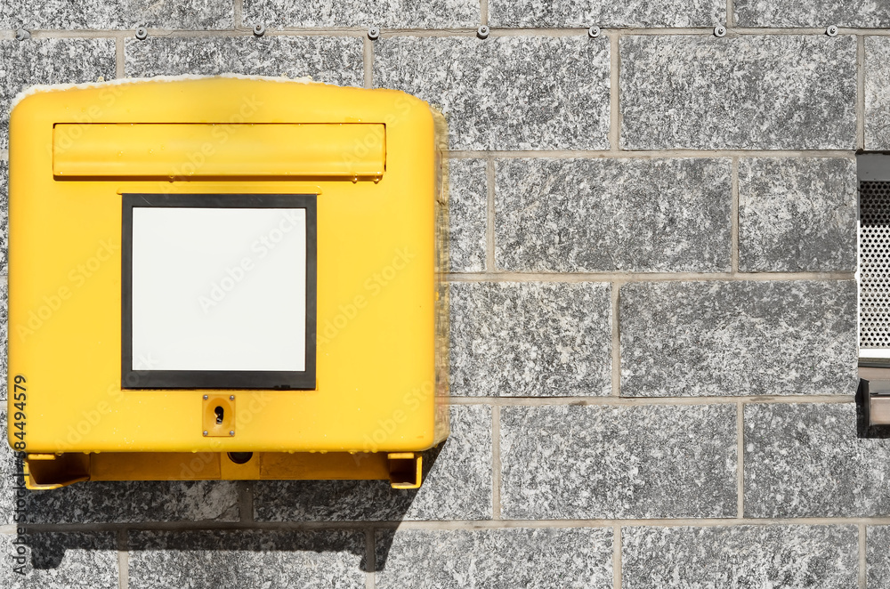 View of mailbox on brick building wall