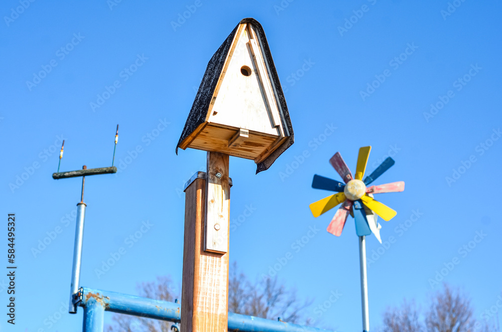 View of wooden bird house on sunny day, closeup