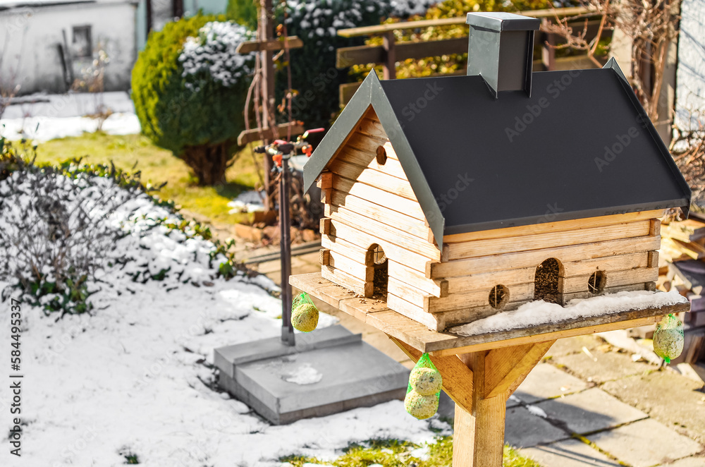 View of wooden bird house on winter day, closeup