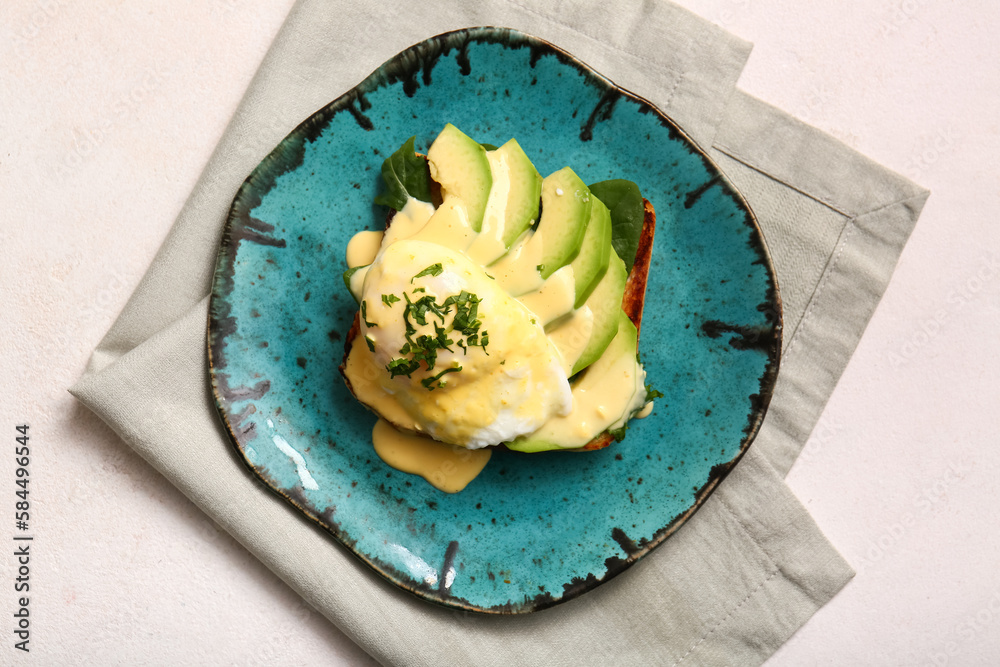 Plate with tasty egg Benedict on white table