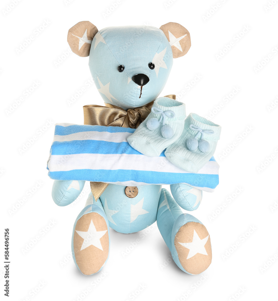 Toy bear with baby clothes on white background