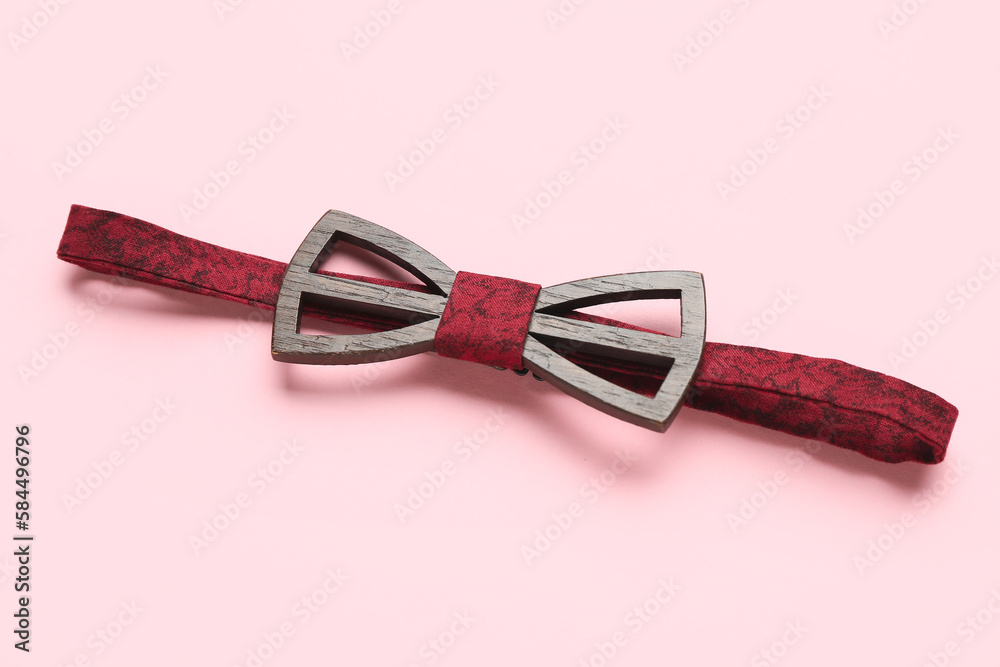 Stylish bow tie on pink background