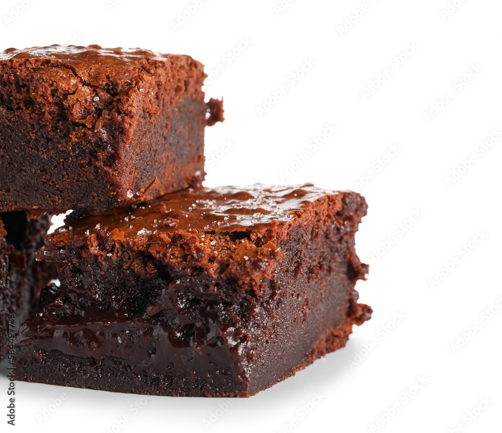 Pieces of tasty chocolate brownie isolated on white background, closeup