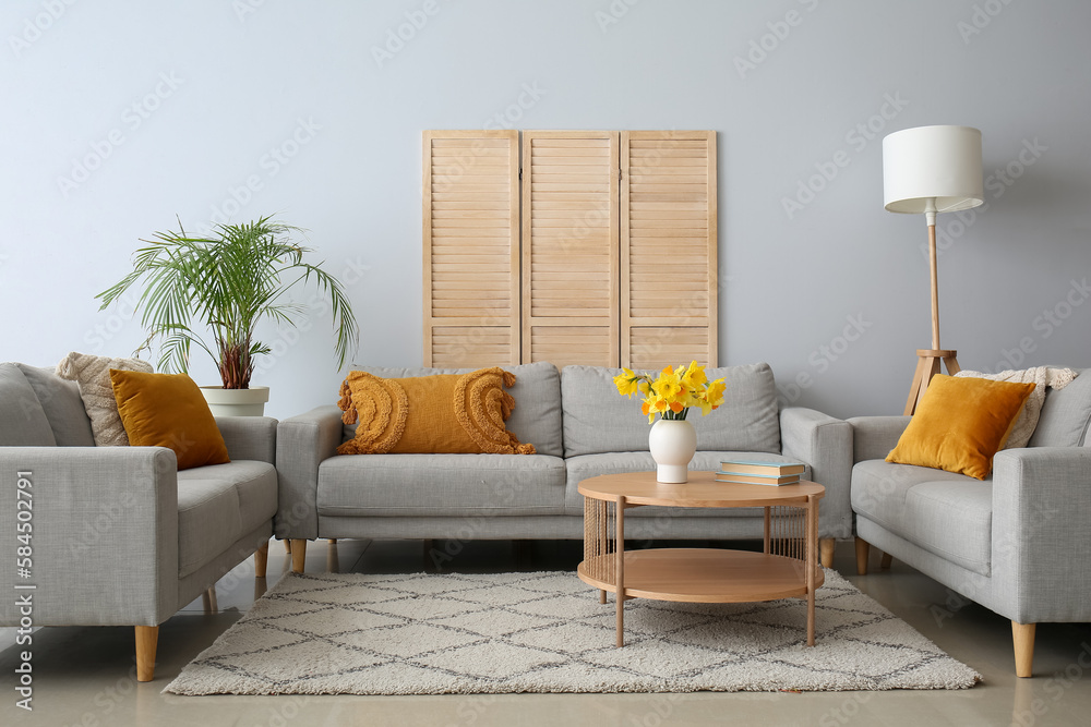 Interior of living room with cozy sofas and coffee table