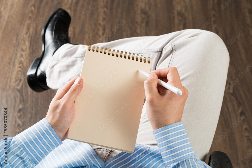 businessman with notepad, works in the office