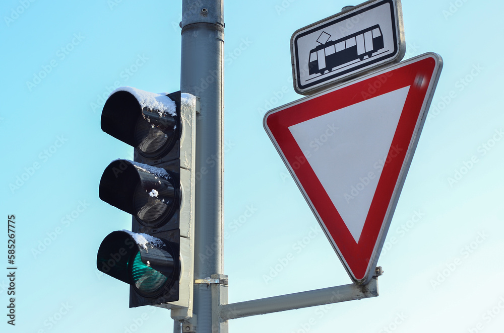 View of traffic lights with road signs in city, closeup