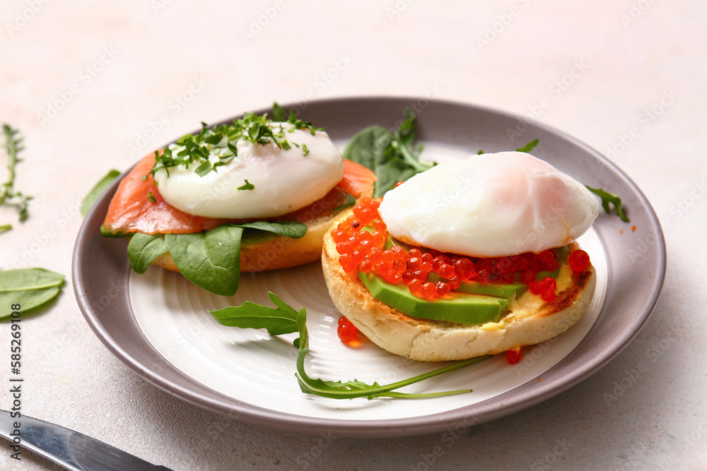 Plate with tasty eggs Benedict on white table, closeup