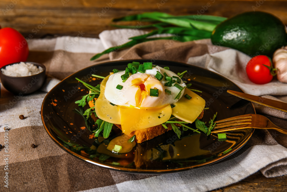 Plate with tasty egg Benedict on table