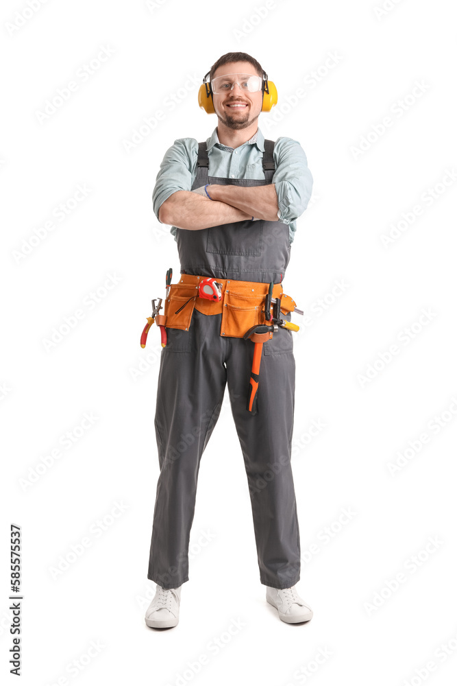 Male carpenter in hearing protectors on white background