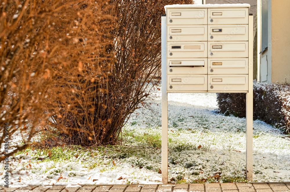 View of mailboxes in city on winter day