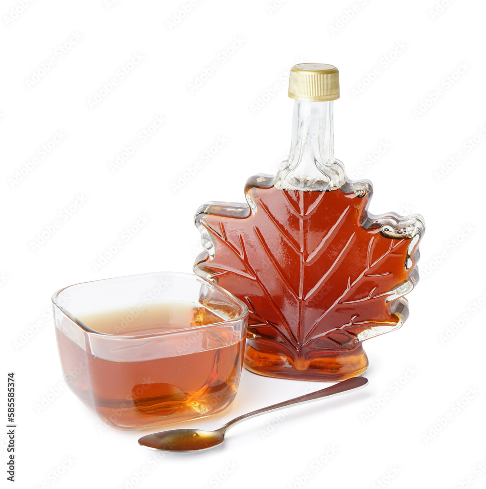 Bottle and bowl of tasty maple syrup on white background