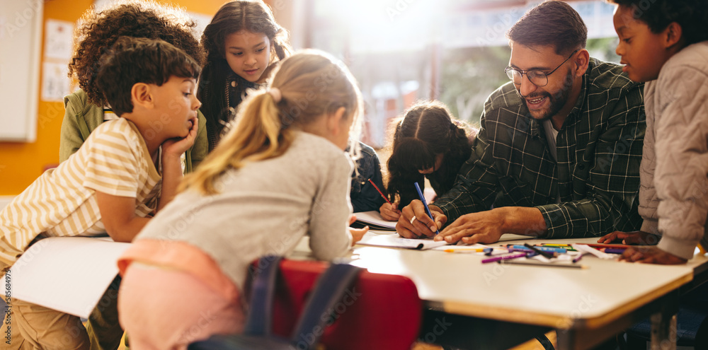 Group of elementary school kids having an art lesson with their teacher