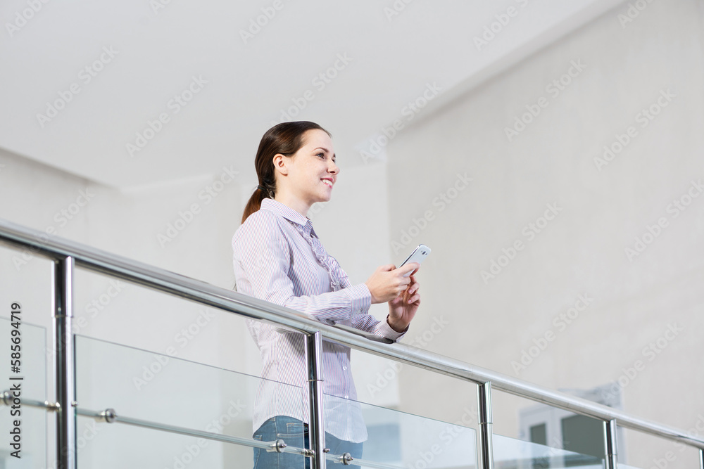 young attractive woman with phone in her hands