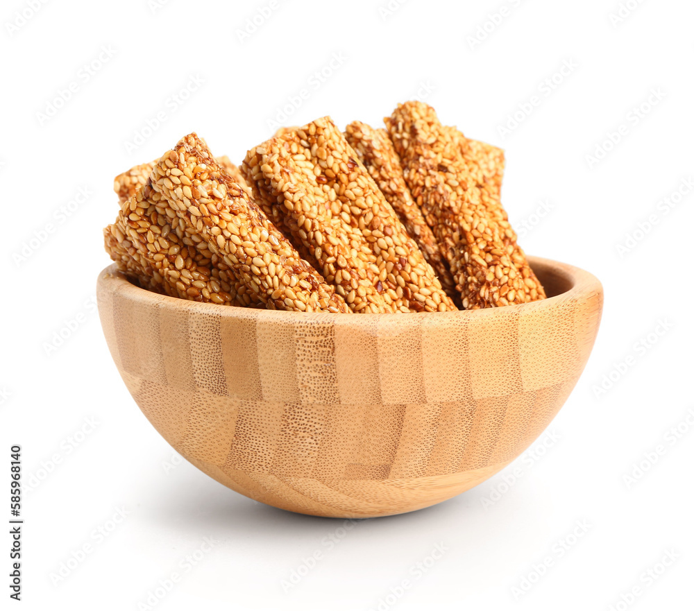 Bowl of tasty sesame kozinaki isolated on white background