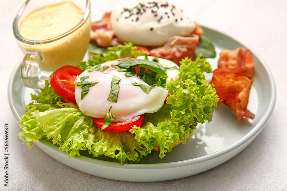 Plate with tasty egg Benedict on white table, closeup