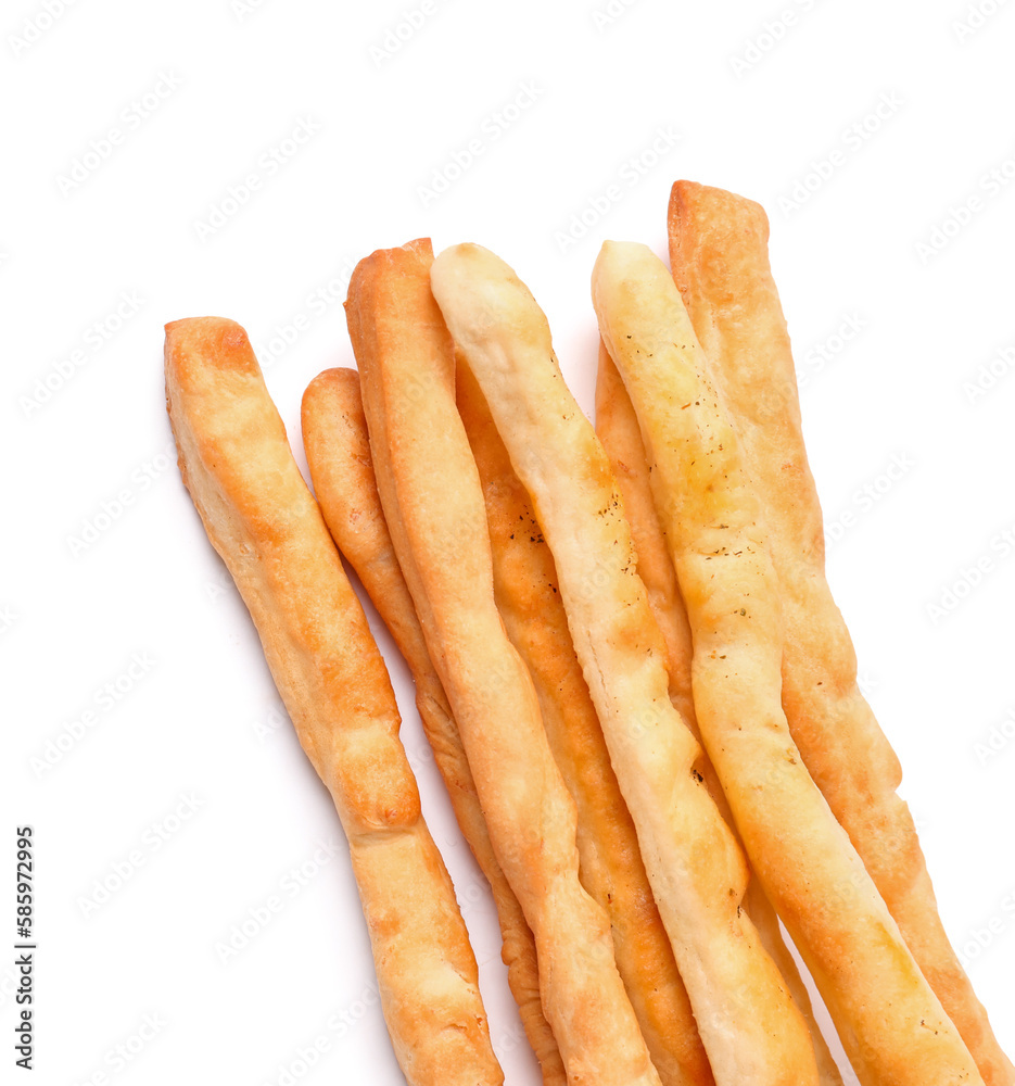 Tasty Italian Grissini on white background, closeup