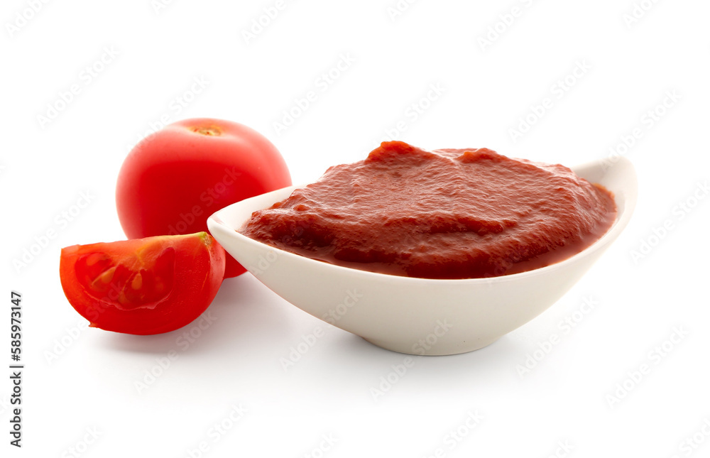 Bowl with tasty tomato paste on white background