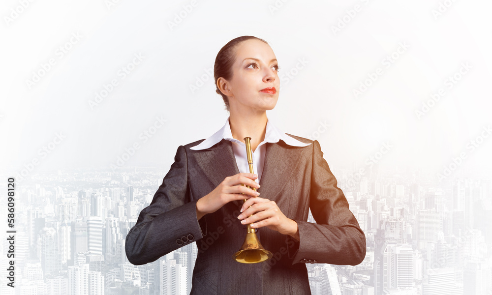 Business woman playing the trumpet