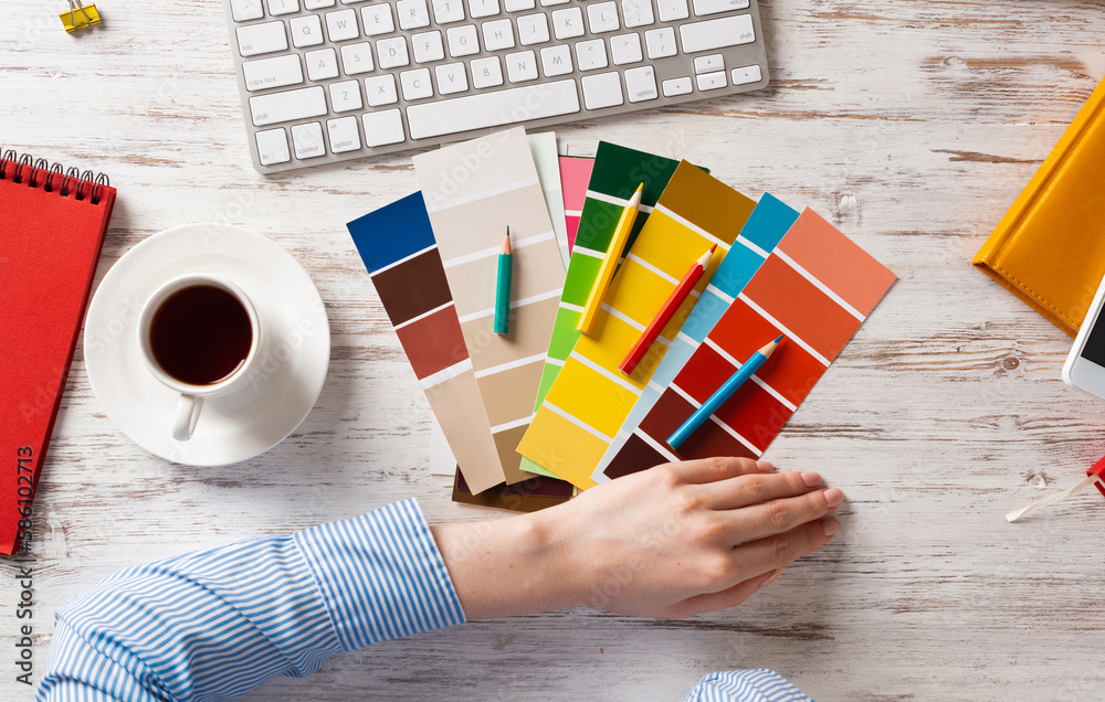 Web designer choosing colors from swatches