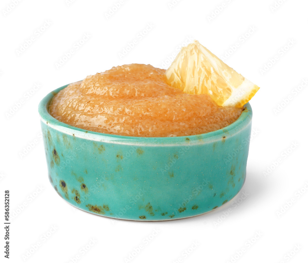 Bowl with caviar of capelin and lemon slice isolated on white background