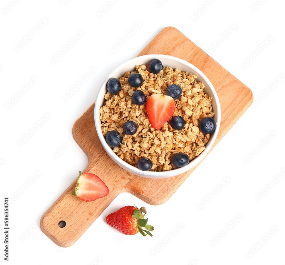 Bowl of tasty granola with berries on white background