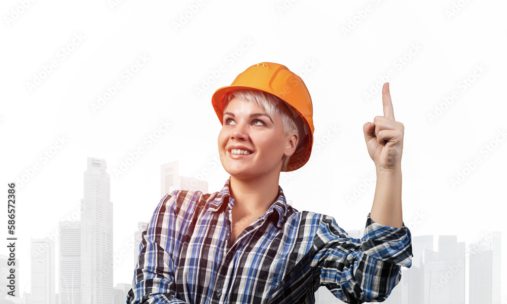 Beautiful female builder in hardhat