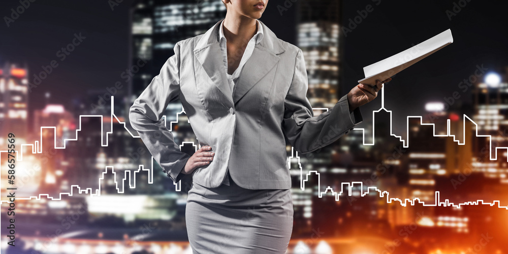 Woman architect or engineer presenting construction concept and holding documents in hand