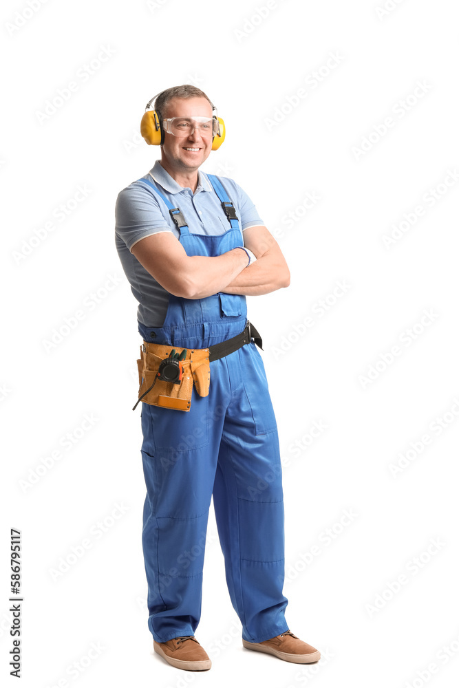 Mature carpenter in hearing protectors on white background