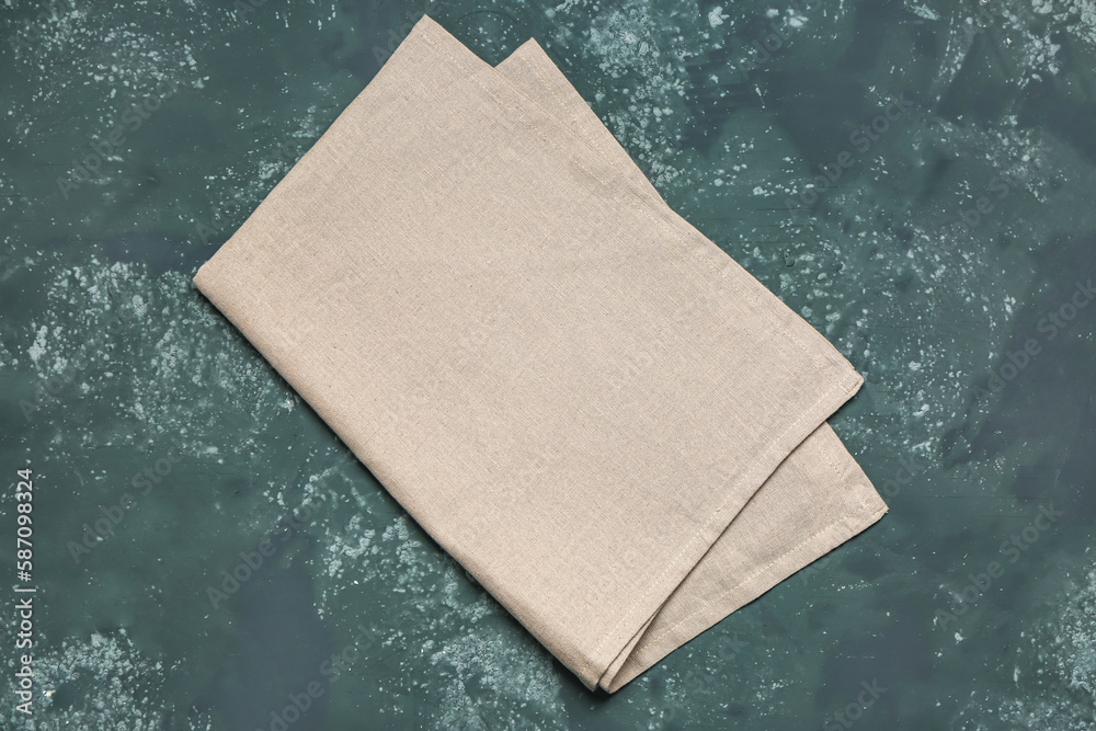 Folded napkin on dark color background